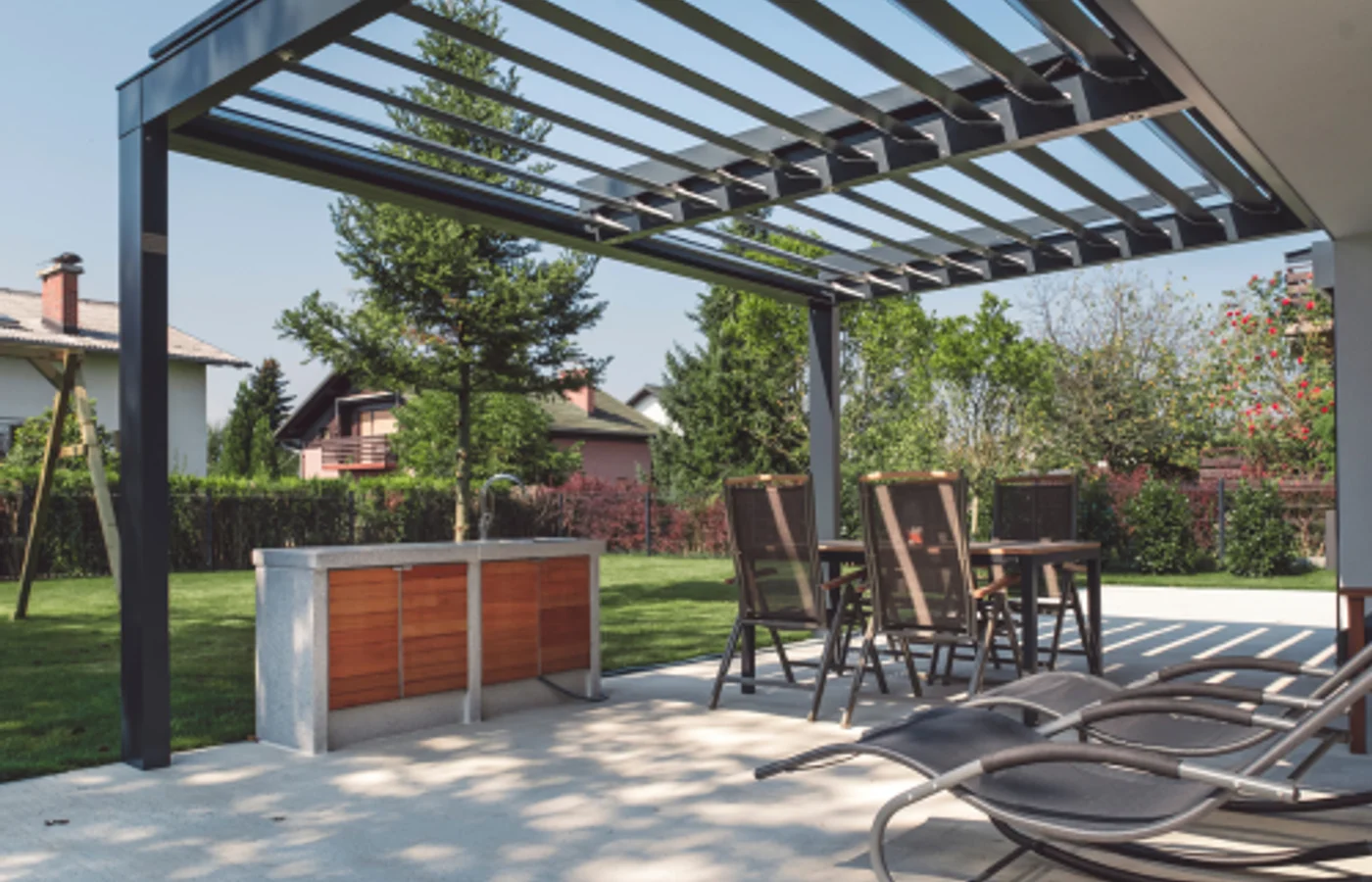 Powder-coated aluminium pergola frame next to a cedar timber beam