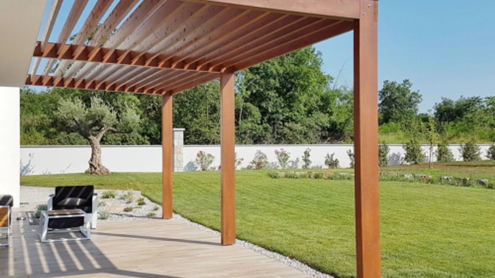 Timber and aluminium pergolas shown side by side